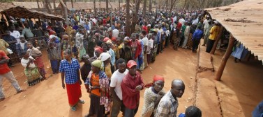 People lining up for mosquito nets in Nyarugusu Camp.